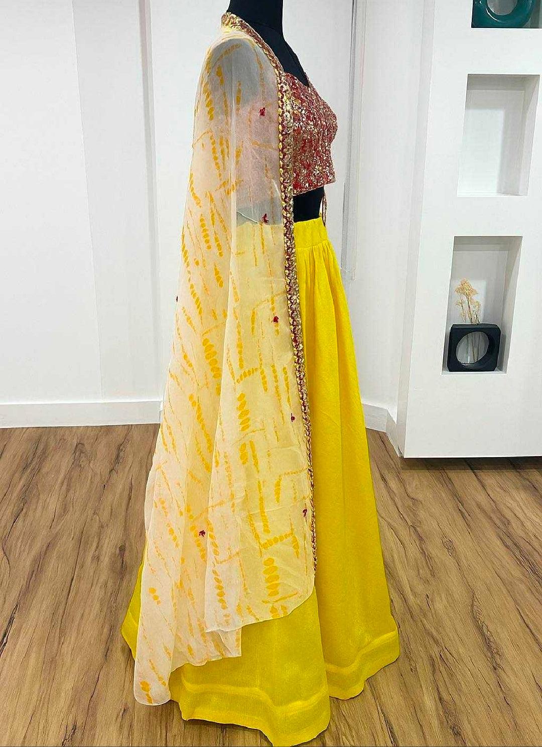 Yellow cape with top and lehenga skirt