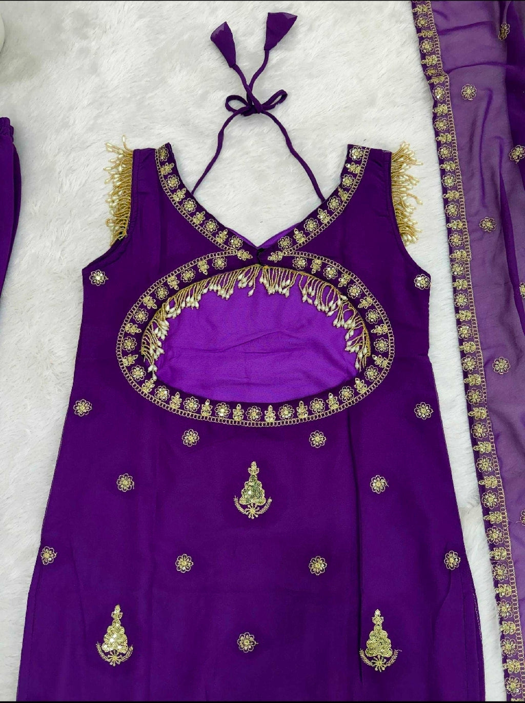 Purple sleeveless suit with pent and dupatta