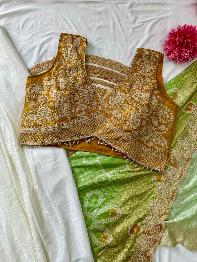 Yellow dhoti skirt with bandhani shrug and top set