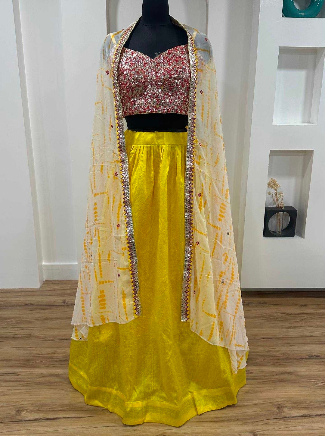 Yellow cape with top and lehenga skirt