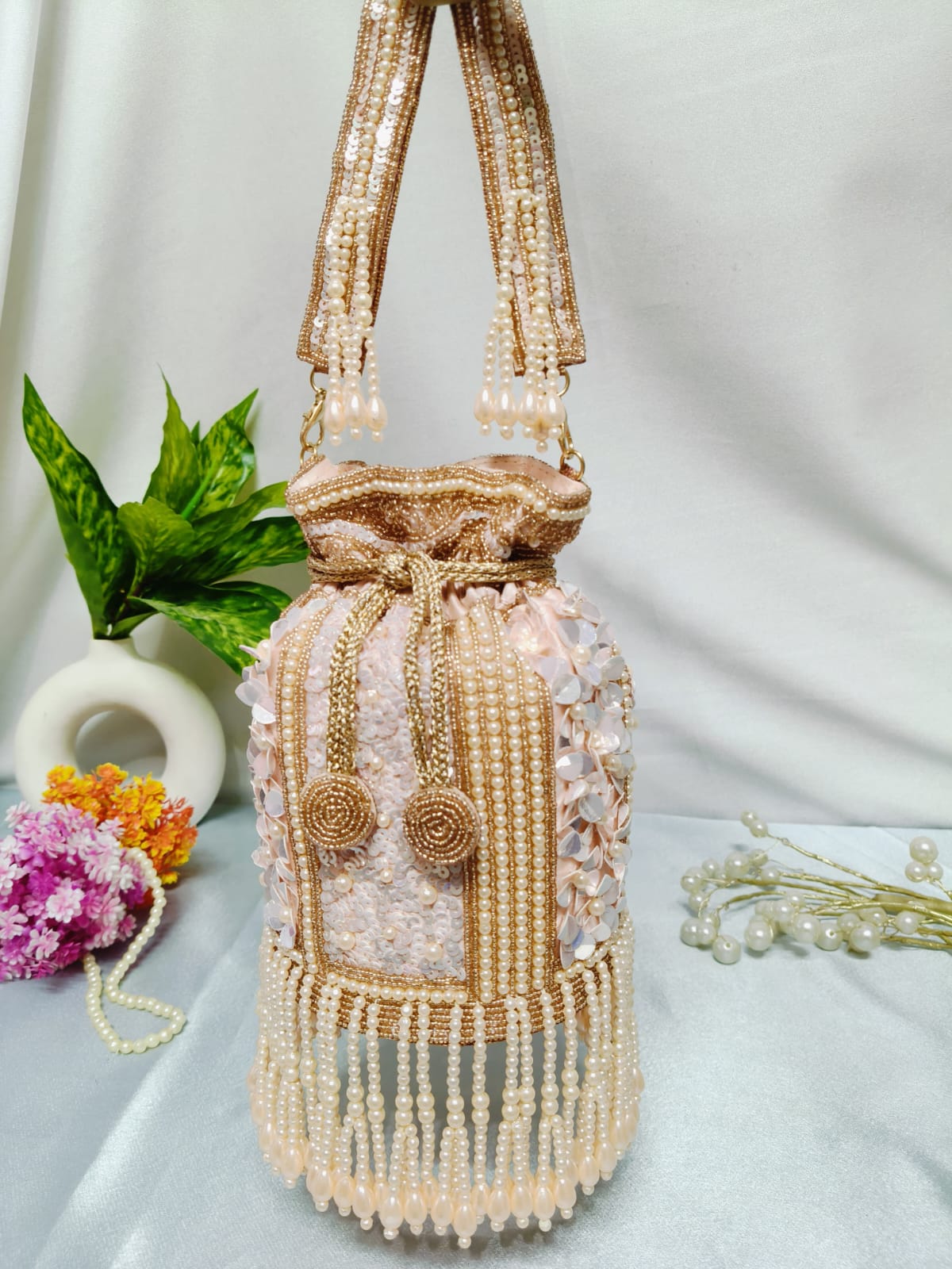 Golden dangling latkan potli bag