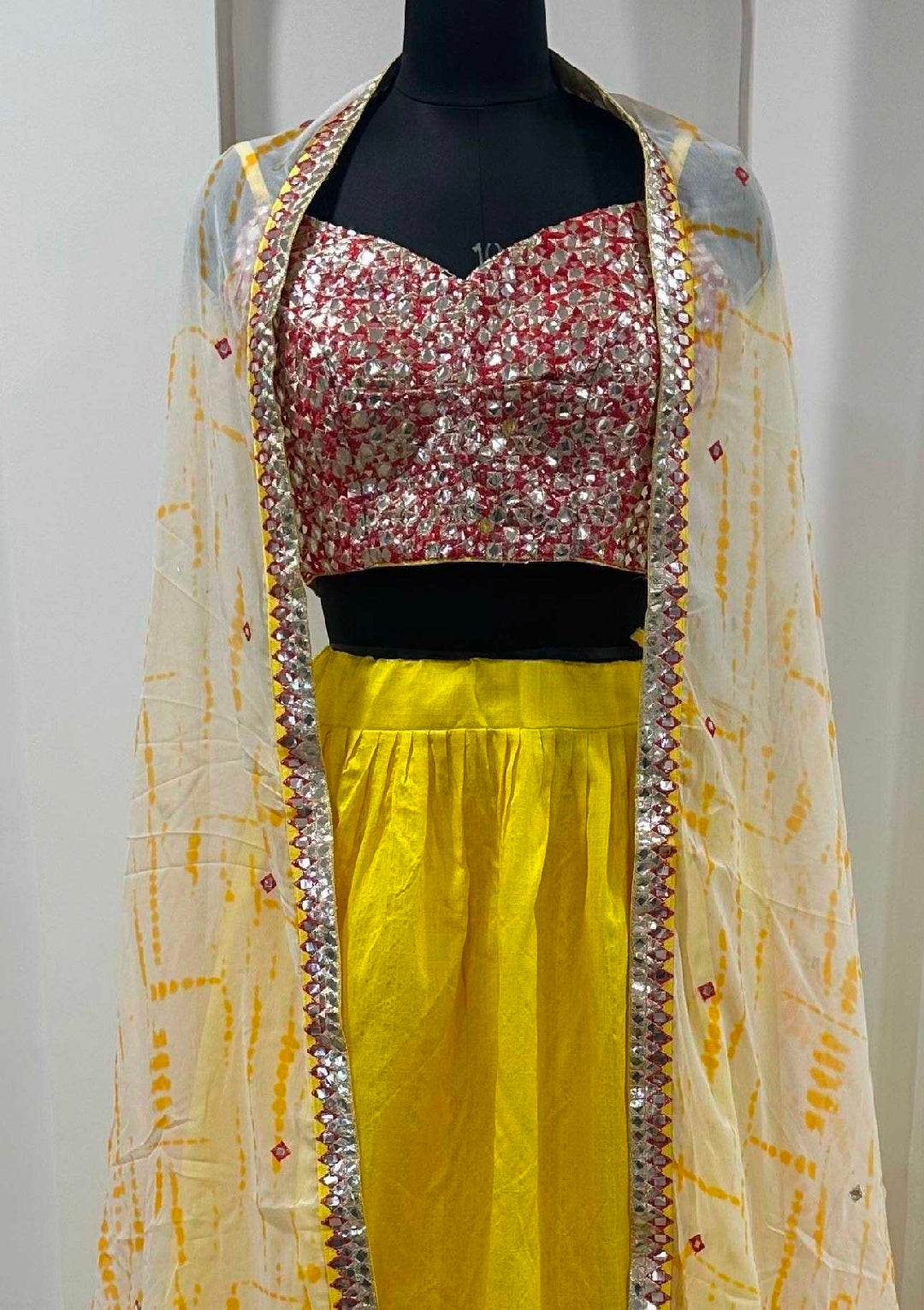 Yellow cape with top and lehenga skirt